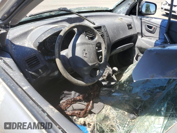 2005 Hyundai Tucson GL with VIN KM8JM12B25U076246, listed as a Copart auction lot 54030704 with 0 mi miles and Salvage Title. Bid and sale history available at carsss.com. Image 8.
