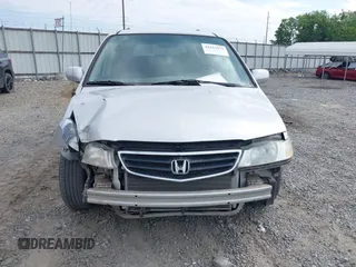 2004 Honda Odyssey EX-L z VIN 5FNRL189X4B013837, wystawiony jako IAAI lot #42215471 z przebiegiem 208 729 mil mil oraz . Historia ofert i sprzedaży dostępna na DreamBid. Obrazek 6.