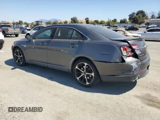 2015 Ford Taurus SEL with VIN 1FAHP2E8XFG209390, listed as a Copart auction lot 58992305 with 99,498 mi miles and Salvage title. Bid and sale history available at DreamBid. Image 2.