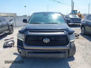 2019 Toyota Tundra SR with VIN 5TFUY5F13KX852912, listed as a IAAI auction lot 42327399 with 124,193 mi miles and . Bid and sale history available at DreamBid. Image 12.