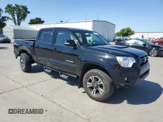 2014 Toyota Tacoma PreRunner with VIN 3TMJU4GN8EM160990, listed as a Copart auction lot 55619165 with 96,327 mi miles and Salvage Title. Bid and sale history available at DreamBid. Image 4.
