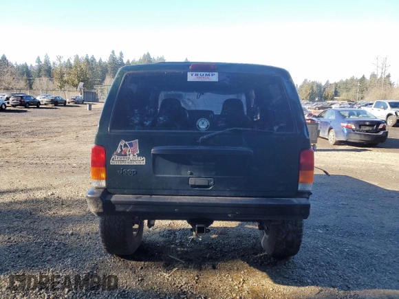 1999 Jeep Cherokee SE with VIN 1J4FF27S9XL667941, listed as a Copart auction lot 42429785 with 121,490 mi miles and Salvage title. Bid and sale history available at DreamBid. Image 6.