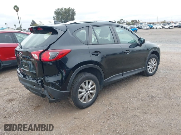 2016 Mazda CX-5 Sport with VIN JM3KE2BY4G0761933, listed as a IAAI auction lot 41709274 with 131,127 mi miles. Bid and sale history available at carsss.com. Image 4.