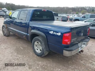 2005 Dodge Dakota SLT with VIN 1D7HW48N65S288584, listed as a IAAI auction lot 42130695 with 221,636 mi miles. Bid and sale history available at carsss.com. Image 3.