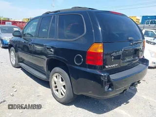 2006 GMC Envoy Denali with VIN 1GKES63M262344853, listed as a IAAI auction lot 42024960 with 183,066 mi miles. Bid and sale history available at carsss.com. Image 3.