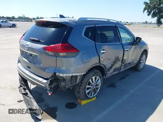 2017 Nissan Rogue SV with VIN KNMAT2MT9HP581822, listed as a IAAI auction lot 42140794 with 74,261 mi miles. Bid and sale history available at carsss.com. Image 4.