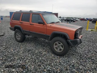 1999 Jeep Cherokee Sport with VIN 1J4FF68S7XL560943, listed as a Copart auction lot 58425505 with 68,654 mi miles and Salvage title. Bid and sale history available at DreamBid. Image 4.
