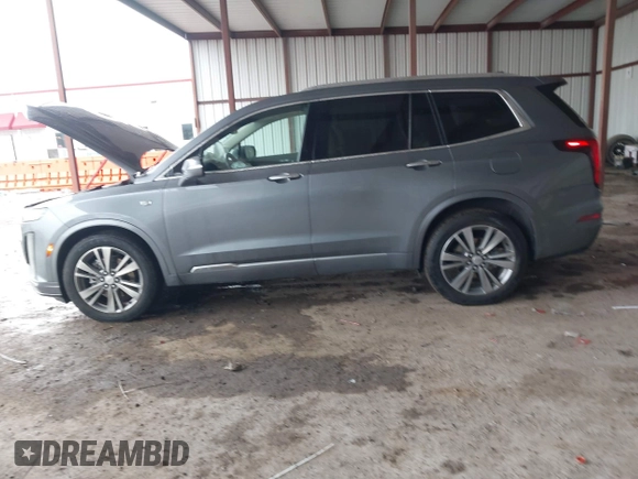 2022 Cadillac XT6 Premium Luxury z VIN 1GYKPDRS1NZ108012, wystawiony jako IAAI lot #41178333 z przebiegiem 83 987 mil mil oraz . Historia ofert i sprzedaży dostępna na DreamBid. Obrazek 14.