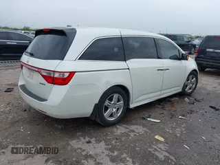2013 Honda Odyssey Touring with VIN 5FNRL5H96DB074819, listed as a IAAI auction lot 41898358 with 123,428 mi miles and . Bid and sale history available at carsss.com. Image 4.