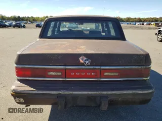 1989 Dodge Dynasty z VIN 1B3BC4637KD532206, wystawiony jako Copart lot #74233744 z przebiegiem 85 245 mil mil oraz Czysty tytuł • Clean title. Historia ofert i sprzedaży dostępna na DreamBid. Obrazek 6.