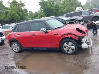 2017 MINI Hardtop 4 Door Cooper with VIN WMWXU1C58H2E18094, listed as a IAAI auction lot 42312473 with 50,482 mi miles and . Bid and sale history available at DreamBid. Image 14.