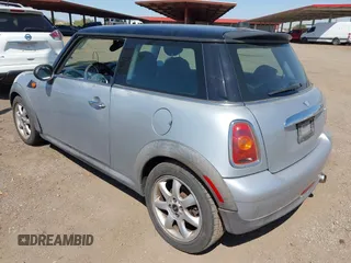 2007 MINI Hardtop with VIN WMWMF33547TL77235, listed as a IAAI auction lot 42547245 with 144,179 mi miles and . Bid and sale history available at DreamBid. Image 3.