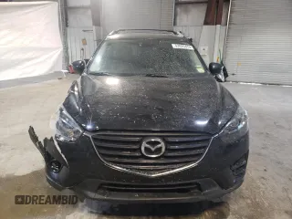 2016 Mazda CX-5 Grand Touring with VIN JM3KE4DY6G0655802, listed as a Copart auction lot 43820475 with 76,639 mi miles and Salvage Title. Bid and sale history available at carsss.com. Image 5.