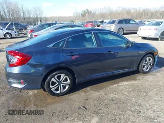 2017 Honda Civic LX with VIN 19XFC2F52HE069033, listed as a IAAI auction lot 41866390 with 68,050 mi miles and . Bid and sale history available at DreamBid. Image 14.