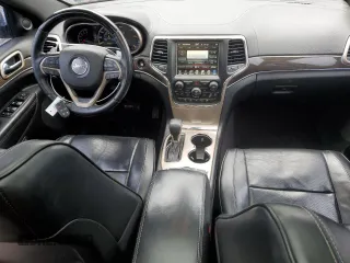 2017 Jeep Grand Cherokee Overland with VIN 1C4RJFCG0HC836448, listed as a Copart auction lot 47053705 with 87,459 mi miles and Salvage Title. Bid and sale history available at carsss.com. Image 8.