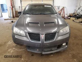 2009 Pontiac G8 z VIN 6G2ER57739L205634, wystawiony jako Copart lot #58935145 z przebiegiem 181 490 mil mil oraz Czysty tytuł • Clean title. Historia ofert i sprzedaży dostępna na DreamBid. Obrazek 5.