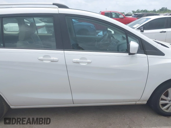 2012 Mazda 5 Sport with VIN JM1CW2BLXC0114770, listed as a IAAI auction lot 42147656 with 99,908 mi miles and . Bid and sale history available at DreamBid. Image 13.