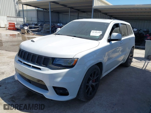 2017 Jeep Grand Cherokee SRT with VIN 1C4RJFDJ0HC699537, listed as a IAAI auction lot 41781500 with 105,640 mi miles. Bid and sale history available at carsss.com. Image 2.