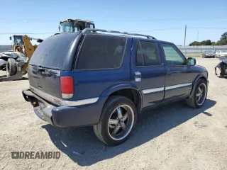 2001 GMC Jimmy SLE Rental Fleet z VIN 1GKDT13W212108144, wystawiony jako Copart lot #58753865 z przebiegiem 254 402 mil mil oraz Szkoda całkowita • Salvage title. Historia ofert i sprzedaży dostępna na DreamBid. Obrazek 3.