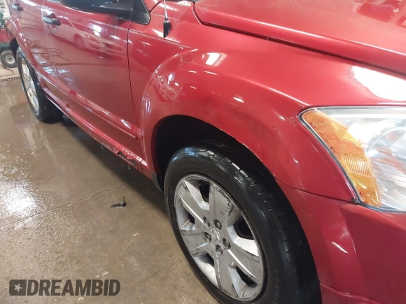 2007 Dodge Caliber SXT with VIN 1B3HB48B67D516782, listed as a IAAI auction lot 41907432 with 185,201 mi miles and . Bid and sale history available at DreamBid. Image 13.
