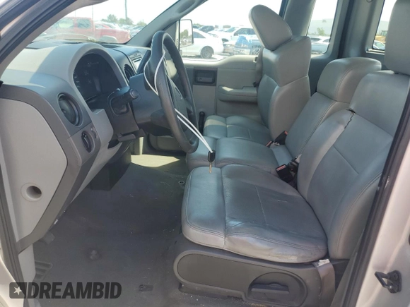 2005 Ford F-150 XL with VIN 1FTRF12225NC03167, listed as a Copart auction lot 61046445 with 153,050 mi miles and Salvage title. Bid and sale history available at DreamBid. Image 7.