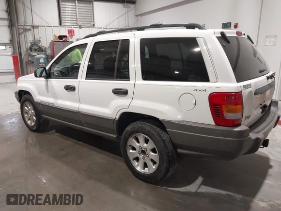 2000 Jeep Grand Cherokee Laredo z VIN 1J4GW48NXYC244327, wystawiony jako IAAI lot #41832166 z przebiegiem 250 822 mil mil oraz . Historia ofert i sprzedaży dostępna na DreamBid. Obrazek 3.