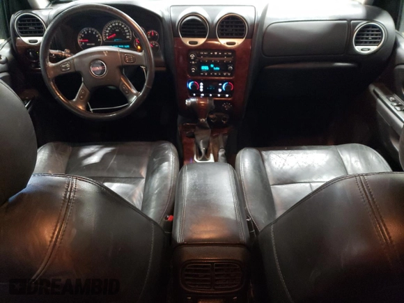 2005 GMC Envoy SLE z VIN 1GKDT13S452360609, wystawiony jako Copart lot #56188495 z przebiegiem 180 046 mil mil oraz Szkoda całkowita • Salvage title. Historia ofert i sprzedaży dostępna na DreamBid. Obrazek 8.