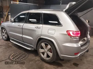 2015 Jeep Grand Cherokee Overland with VIN 1C4RJFCG1FC215426, listed as a IAAI auction lot 41689821 with 128,563 mi miles. Bid and sale history available at carsss.com. Image 3.