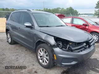 2015 Volkswagen Tiguan SE with VIN WVGAV7AX1FW572027, listed as a IAAI auction lot 42486651 with 121,378 mi miles and . Bid and sale history available at DreamBid. Image 1.