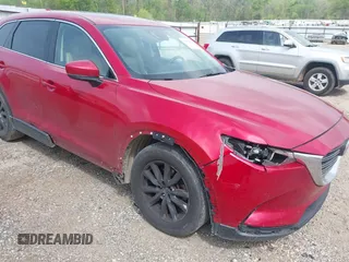 2016 Mazda CX-9 Touring z VIN JM3TCACY0G0101617, wystawiony jako IAAI lot #41850485 z przebiegiem 292 880 mil mil oraz . Historia ofert i sprzedaży dostępna na DreamBid. Obrazek 6.