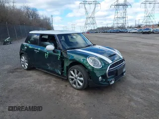 2014 MINI Hardtop S with VIN WMWXM7C52ET731261, listed as a IAAI auction lot 41595236 with 97,299 mi miles and . Bid and sale history available at DreamBid. Image 1.