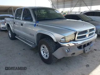 2002 Dodge Dakota SLT with VIN 1B7HG48N62S546119, listed as a IAAI auction lot 41826998 with 157,761 mi miles. Bid and sale history available at carsss.com. Image 1.