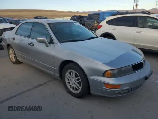 2000 Mitsubishi Diamante LS z VIN 6MMAP67P5YT006608, wystawiony jako Copart lot #49009455 z przebiegiem 241 503 mil mil oraz Tytuł czysty. Historia ofert i sprzedaży dostępna na DreamBid. Obrazek 4.
