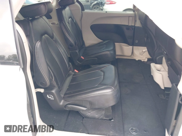 2023 Chrysler Pacifica Touring L with VIN 2C4RC1BG8PR535446, listed as a IAAI auction lot 42307923 with 65,718 mi miles and . Bid and sale history available at DreamBid. Image 8.