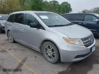 2012 Honda Odyssey EX-L with VIN 5FNRL5H60CB139670, listed as a IAAI auction lot 42072493 with 142,380 mi miles. Bid and sale history available at carsss.com. Image 1.