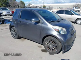2012 Scion iQ with VIN JTNJJXB00CJ009265, listed as a IAAI auction lot 41742947 with 95,857 mi miles. Bid and sale history available at carsss.com. Image 1.