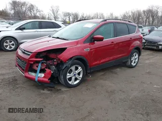 2014 Ford Escape SE with VIN 1FMCU9GX7EUC35483, listed as a IAAI auction lot 41704298 with 105,017 mi miles. Bid and sale history available at carsss.com. Image 2.