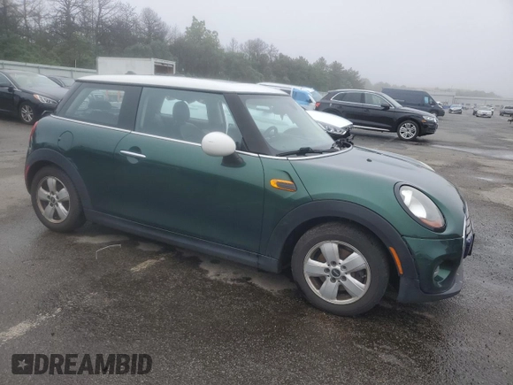 2017 MINI Hardtop Cooper with VIN WMWXP5C55H2D16587, listed as a Copart auction lot 60855195 with 77,769 mi miles and Salvage title. Bid and sale history available at DreamBid. Image 4.