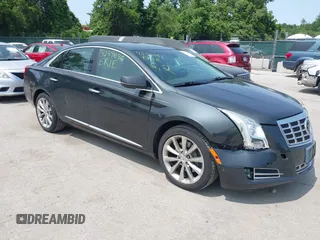 2013 Cadillac XTS Premium z VIN 2G61T5S38D9220243, wystawiony jako IAAI lot #42391086 z przebiegiem 145 161 mil mil oraz . Historia ofert i sprzedaży dostępna na DreamBid. Obrazek 1.
