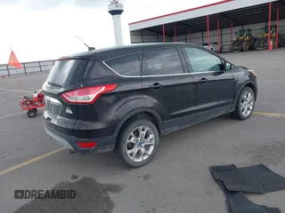 2013 Ford Escape SEL z VIN 1FMCU9H90DUC34965, wystawiony jako IAAI lot #42361165 z przebiegiem 177 387 mil mil oraz . Historia ofert i sprzedaży dostępna na DreamBid. Obrazek 4.
