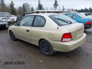 2002 Hyundai Accent GL with VIN KMHCG35CX2U199532, listed as a IAAI auction lot 41839270 with 200,232 mi miles. Bid and sale history available at carsss.com. Image 3.
