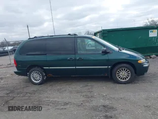 1999 Chrysler Town & Country with VIN 1C4GP54G6XB603564, listed as a IAAI auction lot 41823340 with 104,321 mi miles and . Bid and sale history available at DreamBid. Image 13.