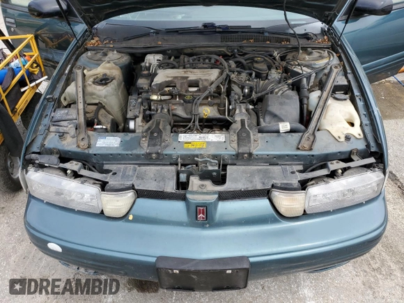 1997 Oldsmobile Cutlass Supreme S z VIN 1G3WH52MXVF317238, wystawiony jako Copart lot #53523905 z przebiegiem 135 925 mil mil oraz Szkody całkowita. Historia ofert i sprzedaży dostępna na DreamBid. Obrazek 11.