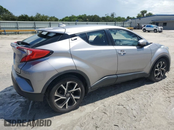 2018 Toyota C-HR XLE with VIN NMTKHMBX7JR021704, listed as a Copart auction lot 71171874 with 82,872 mi miles and Salvage Title. Bid and sale history available at DreamBid. Image 3.