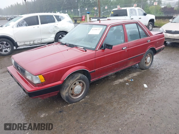 1990 Nissan Sentra z VIN JN1GB21B5LU503902, wystawiony jako IAAI lot #42358723 z przebiegiem 172 484 mil mil oraz . Historia ofert i sprzedaży dostępna na DreamBid. Obrazek 2.