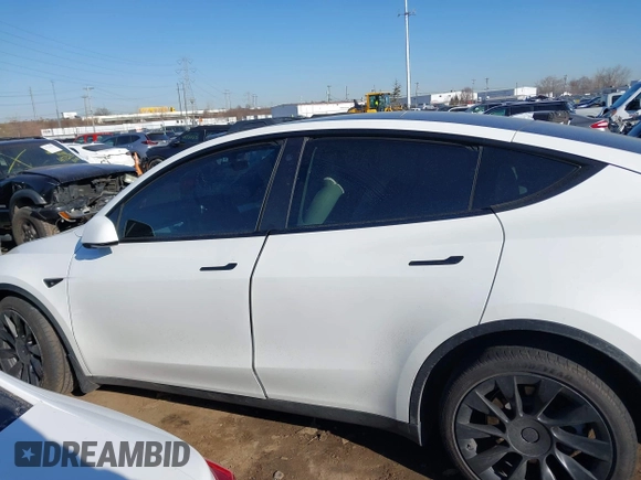 2021 Tesla Model Y Long Range with VIN 5YJYGDEE5MF203175, listed as a IAAI auction lot 41758334 with 63,387 mi miles and . Bid and sale history available at DreamBid. Image 14.