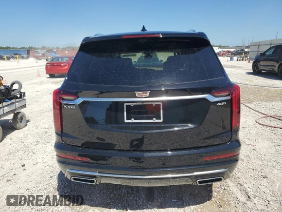 2024 Cadillac XT6 Premium Luxury z VIN 1GYKPERS1RZ755490, wystawiony jako Copart lot #49706575 z przebiegiem 4 239 mil mil oraz Szkoda całkowita • Salvage title. Historia ofert i sprzedaży dostępna na DreamBid. Obrazek 6.