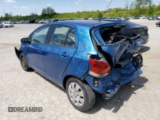 2009 Toyota Yaris with VIN JTDKT903895237298, listed as a Copart auction lot 50908243 with 117,668 mi miles and Salvage Title. Bid and sale history available at carsss.com. Image 2.