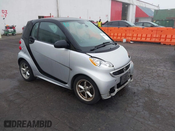 2015 Smart fortwo Passion with VIN WMEEJ3BA9FK819985, listed as a IAAI auction lot 41879486 with 79,394 mi miles. Bid and sale history available at carsss.com. Image 1.