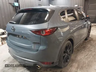 2021 Mazda CX-5 Touring with VIN JM3KFBCM5M0365725, listed as a IAAI auction lot 41411763 with 77,504 mi miles. Bid and sale history available at carsss.com. Image 4.